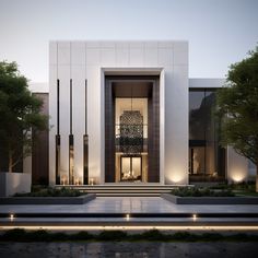 the front entrance to a modern house with lights on and steps leading up to it