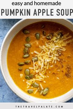 pumpkin and apple soup in a white bowl topped with shredded cheese