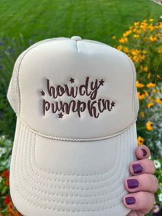 Add a touch of Southern sweetness to your style with our embroidered hat featuring the word 'howdy pumpkin' embroidered with a western script.  This classic sand-beige colored trucker cap is perfect for anyone who loves Southern charm and effortless style with colors ready for fall! Whether you're heading to a pumpkin patch, a day out with friends, or simply want to express your playful side, this hat is a must-have accessory. Details: Colors Available: Sand (Beige), Material: Polyester Foam Front truck cap with Mesh Back adjustable straps Size: One size fits most (adjustable strap) Embroidery: machine embroidered by me using high quality thread   Style: Otto foam trucker cap with a splash of western charm.     Pricing:$25 Shipping:$2 *Processing Time: 1 -2days *Shipping Time: 3-5 business Adjustable Fall Trucker Hat With Curved Brim, Adjustable Curved Brim Trucker Hat For Fall, Adjustable Trucker Hat With Curved Brim For Fall, Fall Cap Hat, White Fall Hat, One Size Fits Most, Adjustable Fall Baseball Cap, Trendy Fall Baseball Cap, Adjustable Baseball Cap For Fall, Fun Adjustable Trucker Hat For Country Events