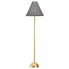 a gold floor lamp with a black shade