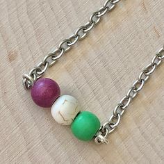 This necklace features a dyed Howlite beaded bar focal (0.75'' width) on an 18'' silver plated metal cable chain necklace with silver plated metal lobster clasp and 2'' silver plated metal curb chain extender. Nickel and Lead Free. ------------------------------ **100% of the profits made from this necklace sale will be donated to the Triangle Community Center in support of Bethel CT Pride. Bethel CT Pride is proud to host the only LGBTQ+ parade celebration in northwestern Connecticut. By donati Lgbtq Parade, Balloon Earrings, Necklace Sale, Beaded Chandelier Earrings, Bead Bar, Cardboard Jewelry Boxes, Cable Chain Necklace, Community Center, Beaded Chandelier