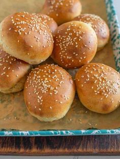 small buns with sesame seeds on a blue and white plate