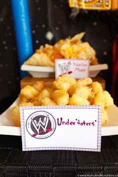 there is a plate with tater tots on it and a sign that says underintters