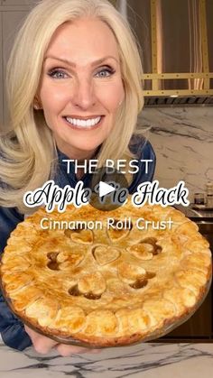 a woman holding up a pie with the caption, the best apple pie black cinnamon roll crust