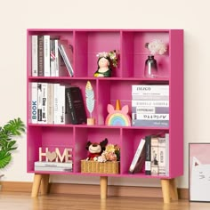 a pink book shelf filled with lots of books