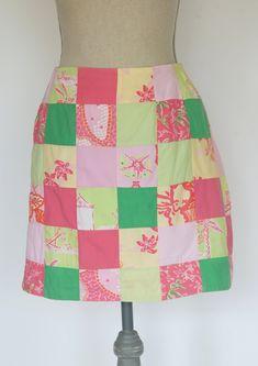 "\"Anything is possible with sunshine and a little pink.\" -Lilly Pulitzer     There is lots of pink in this Purdy little patchwork skirt. The print is a patchwork composed of solid squares of bright and pale pink and bright and pale green. The patterned squares consist of monkeys, palm trees and flowers. The skirt is fully lined with a 6-1/2 inch zipper in the back. Size 2. *Please see measurements.    Measurements:    -Waist: 27 inches    -Hips: 38 inches    -Width at hem: 39 lnches    -Length: 17 inches   For more lovely handmade, vintage and vintage-inspired , and handmade items,shop: www.etsy.com/shop/MadeleinesCollection" Casual Pink Patchwork Skirt, Spring Pink Patchwork Skirt, Pink Cotton Patchwork Skirt, Fitted Pink Patchwork Skirt, Pink Lilly, Trees And Flowers, Pink Lillies, Vintage Lilly Pulitzer, Patchwork Skirt