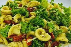 a close up of a plate of food with broccoli and pasta on it