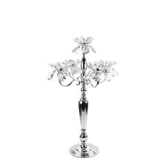 a silver vase with crystal flowers in it on a white background and the base is made out of metal