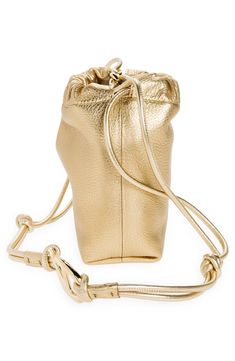 Golden VLOGO hardware anchors the casually knotted strap of a soft drawstring bag crafted in Italy from richly pebbled calfskin in a shining metallic hue. Drawstring closure Removable crossbody strap Flat base for stability Leather Made in Italy Designer Handbags Luxury Gold Bucket Bag For Daily Use, Gold Pouch Bucket Bag For Daily Use, Gold Leather Bucket Bag, Gold Bucket Bag With Dust Bag For Daily Use, Luxury Gold Bucket Bag For Shopping, Gold Leather Bucket Bag With Gold-tone Hardware, Everyday Leather Shoulder Bag With Loop Closure, Gold Bucket Bag With Adjustable Strap, Chic Gold Bucket Bag For Travel