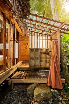 an outdoor shower in the middle of a forest