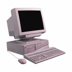 an old computer with a mouse and keyboard