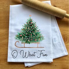 three napkins with a christmas tree on them and the words what fun printed on them