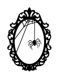 a mirror with a spider hanging from it's side