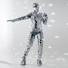 a futuristic woman in silver is holding her arms out to the side with both hands