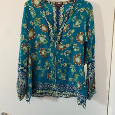 Beautiful Blouse - New, Never Worn - Long Sleeve Size Is Medium *Willing To Accept Reasonable Offers* Any Questions? Don’t Hesitate To Ask! Casual Turquoise V-neck Blouse, Blue Floral Print Tunic Top, Turquoise Long Sleeve Top For Summer, Turquoise Long Sleeve Blouse, Blue Bohemian V-neck Tops, Fitted Bohemian Blue Blouse, Turquoise Long Sleeve Beach Top, Long Sleeve Turquoise Tops For Vacation, Turquoise Long Sleeve Tops For Vacation