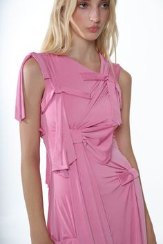 Asmmetrical dress in PinkBow details throughoutMade with a lightweight stretchy fabricConcealed zipper at sideMade in NYC Fits true to sizeModel is 5'9 and wearing a size XS Size Length Chest Waist XS 43" 25 1/2" 23" S 43 1/2" 27 1/2" 25" M 44" 29 1/2" 27" L 44 1/2" 31 1/2" 29" XL 45" 34 1/2" 32" 95% Polyester, 5% Spandex Size Guide + Shipping Info Monthly payments available at checkout with Affirm. Nyc Fits, Hair Socks, Monthly Payments, Ribbon Dress, Uniform Dress, Sandy Liang, Knit Outerwear, Skirt Pants, Size Guide