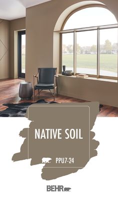 the interior of a house with an open window and chair in front of it that says native soil