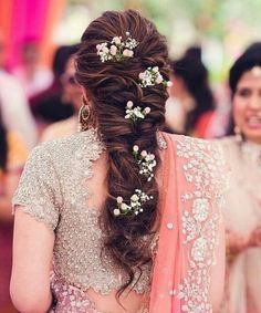 a woman with flowers in her hair