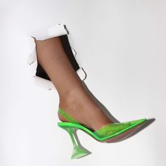 Add a vibrant pop of color to your shoe collection with our Juicy Pointed Toe Neon Transparent Heels from Fiel Shop. These heels are the perfect combination of boldness and modernity. featuring a sleek pointed toe design and a transparent body that creates an illusion of floating neon hues. The vibrant neon color adds a playful and electric touch to any outfit. while the high heel provides a confident and leg-lengthening boost. Crafted with attention to detail. these heels are sure to make a st Green Heels For Spring Cocktail Events, Spring Cocktail Heels With Clear Strap, Modern Heels With Clear Strap For Party, Trendy Green Pointed Toe Heels, Modern Party Heels With Clear Strap, Modern Green Heels With Contrasting Heel Counter, Trendy Party Heels With Contrasting Heel Counter, Trendy Clear Pointed Toe Heels, Green Pointed Toe Heels For Cocktail