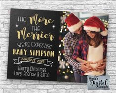 a christmas card with an image of a couple wearing santa hats and holding each other