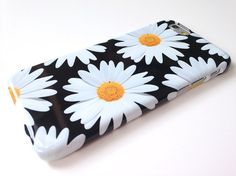 a black and white case with daisies on it