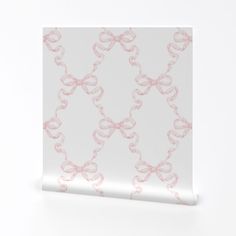 a white and pink wallpaper with bows on the side, against a white background