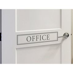 an office door with a black and white sign that says office hanging on the door handle