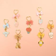 the btt2 keychains are all in different colors and designs, with bows on