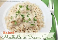 a white plate topped with meatballs and cream sauce