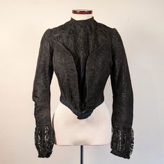 "This lovely bodice or shirt-waist dates from circa 1901, and I have been able to find examples quite similar in shape and style, even down to the sleeves, by searching through issues of The Delineator from that year. (I've included an image from the July 1901 issue in the photos for this listing.) It has an inner bodice with hook and eye closures down the center front and a lace overlay that attaches on the left side with hooks and eyes. A kind of built in bolero gives a layered effect. There i Fitted Long Sleeve Costume Blouse, Fitted Long Sleeve Blouse For Costume, Classic Fitted Victorian Dress With Buttons, Fitted Victorian Dress With Buttons, Victorian Long Sleeve Dress With Buttons, Fitted Victorian Historical Dress, Historical Victorian Dress With Buttons, Elegant Fitted Top For Costume, Victorian Long Sleeve Dress For Fall