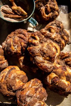 some cinnamon rolls are sitting on a table