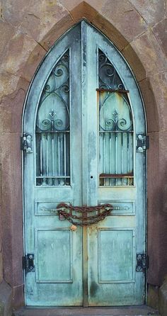 an old door with iron bars on it