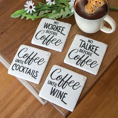 four coasters that say no workee before coffee and drink with flowers in the background