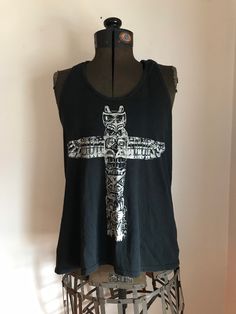 Vintage Ralph Lauren Tribal Shirt Distressed styling Totem pole Graphic  Black and white  tank  top Racer back style tank style T shirt Cowhichan inspired  Workwear  100% Cotton Ralph Lauren Denim and Supply  Size woman's small Approximate measurements in inches: pit to pit: 34 26 down center back length from shoulder to bottom hem: 23.25 Sleeve 25.50 Grunge Tank T-shirt For Summer, Summer Grunge Tank T-shirt, Summer Punk Style Vest Top, Bohemian Graphic Print Tops For Streetwear, Alternative Style Cotton Summer Tops, Edgy Racerback Top For Streetwear, Edgy Racerback Top For Summer, Summer Grunge Tops With Back Print, Alternative Style Cotton Tops For Summer