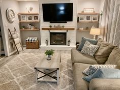 a living room filled with furniture and a flat screen tv mounted on the wall above a fire place