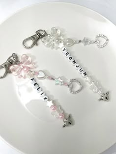 a white plate topped with key chains and charms