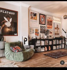 a living room filled with lots of furniture and pictures on the wall next to a bookshelf