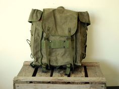 "Italian Army Backpack - Rucksack - Vintage Manbag - Italian Alpini Mountain troops from the late 70s < < < P R O D U C T D E S C R I P T I O N > > > Used by the elite Italian \"Alpini\" Mountain troops, which were established as the world's first dedicated mountain units in the 18th Century to protect Italy's northern Alpine border, this is a fantastic tough but compact canvas rucksack full of functionality. Great bag for hiking, fishing, bushcraft and collectors! The innovative design from the Vintage Khaki Bag For Adventure, Vintage Green Backpack For Everyday Use, Military Style Backpack For Adventure, Vintage Backpack For Outdoor Activities, Vintage Rectangular Backpack With Pockets, Vintage School Backpack With Pockets, Vintage Khaki Backpack, Vintage Rectangular Backpack For Adventure, Khaki Backpack For Camping