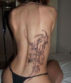 a woman with a tattoo on her back