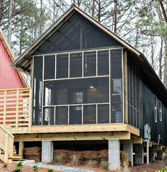 a house in the woods surrounded by trees