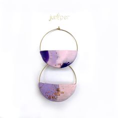 These gorgeous handmade earrings were crafted from polymer clay and gold leaf. Handmade Gold Hoop Earrings With Polymer Clay, Air Dry Clay Lilac Earrings, Purple Resin Earrings, Lilac Clay Earrings, Lilac Polymer Clay Earrings, Unique Purple Polymer Clay Earrings, Moon Shapes, Purple Lilac, Gold Hoop