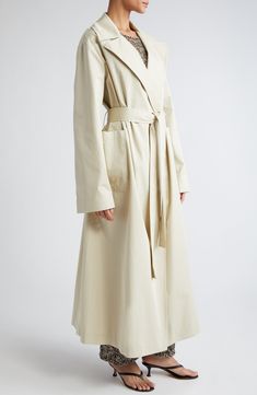 A pared-back trench coat is crafted from Italian cotton and designed to resist raindrops. 53" length (size 36eu) Open front Notched lapels Front patch pockets Removable sash Lined 100% cotton Dry clean Made in Portugal Spring Gabardine Long Raincoat, Modern Spring Workwear Raincoat, Beige Workwear Raincoat With Pockets, Modern Raincoat With Pockets For Spring, Cotton Trench Coat, Spring Wardrobe Essentials, Skirt Swimsuit, Athletic Dress, Womens Watches Luxury