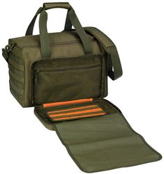 an open green bag sitting on top of a mat