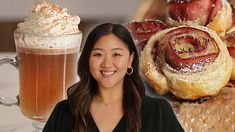 a woman standing in front of pastries and a cup of coffee