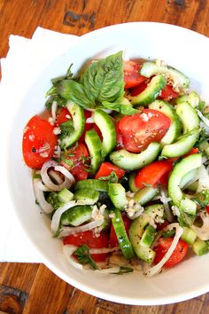 two pictures showing different types of salads in white bowls with the title tomato cucumber and basil salad