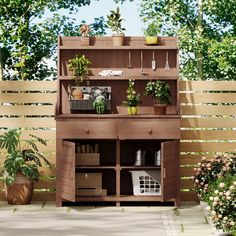 a potted plant sitting on top of a wooden shelf in front of a fence