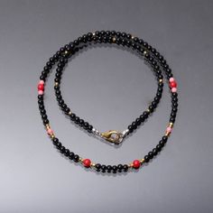 Product Details : ITEM : BLACK ONYX, RED CORAL, PINK CORAL, GOLDEN PYRITE BEADED NECKLACEGemstone Name :  BLACK ONYX, RED CORAL, PINK CORAL, GOLDEN PYRITEChain Style : BEADEDBeads Shape : SMOOTH ROUNDBeads Size : 3mm/4mm/2mm Approx.Length : 18" Inch Approx.Weight : 36Cts. Approx.Customization : **Available**Please Feel Free To Contact If You Have Any Query. Black Beaded Necklaces With Lobster Clasp, Black Necklaces With Round Natural Stones, Adjustable Black Crystal Necklaces With Colorful Beads, Adjustable Black Crystal Necklace With Colorful Beads, Black Jewelry With Lobster Clasp And Round Beads, Black Spiritual Choker Necklace, Black Beaded Necklace With Colorful Beads, Black Beaded Necklaces With Colorful Beads For Spiritual Use, Black Crystal Necklaces With Colorful Beads For Jewelry Making