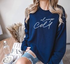 "Baby, it's cold outside. The perfect addition to your wardrobe this holiday season. This \"Always Cold\" sweatshirt will keep you warm on Thanksgiving, Christmas, or traveling. Embrace the brisk season in comfort and style! 👕Brand = Gildan Unisex Heavy Blend Sweatshirt - Classic fit - True to size - Medium-heavy fabric 🎨Color/✂️Design = - All of our shirts are printed by a professional printer using the Full Color - Direct to Garment application. We try to make all representations of color as accurate as possible, but due to the fact that monitor settings can vary, actual colors may vary slightly from what is seen on your screen. 🌿 Fiber composition = 50% cotton, 50% polyester - Made from specially spun fibers that make for a very strong, smooth fabric. Polyester fibers are extremely r Soft-washed Cotton Sweater For Winter, Soft-washed Cotton Winter Sweater, Cozy Fit Cotton Sweatshirt For Cold Weather, Cozy Cotton Sweatshirt For Cold Weather, Trendy Soft-washed Winter Sweater, Soft-washed Long Sleeve Sweatshirt For Winter, Cozy Fit Soft-washed Winter Top, Soft-washed Cozy Winter Top, Cotton Crew Neck Top For Cold Weather