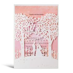 a laser cut card with an image of a man and woman under a tree