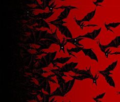 a flock of bats flying through the air over a red background with black dots on it